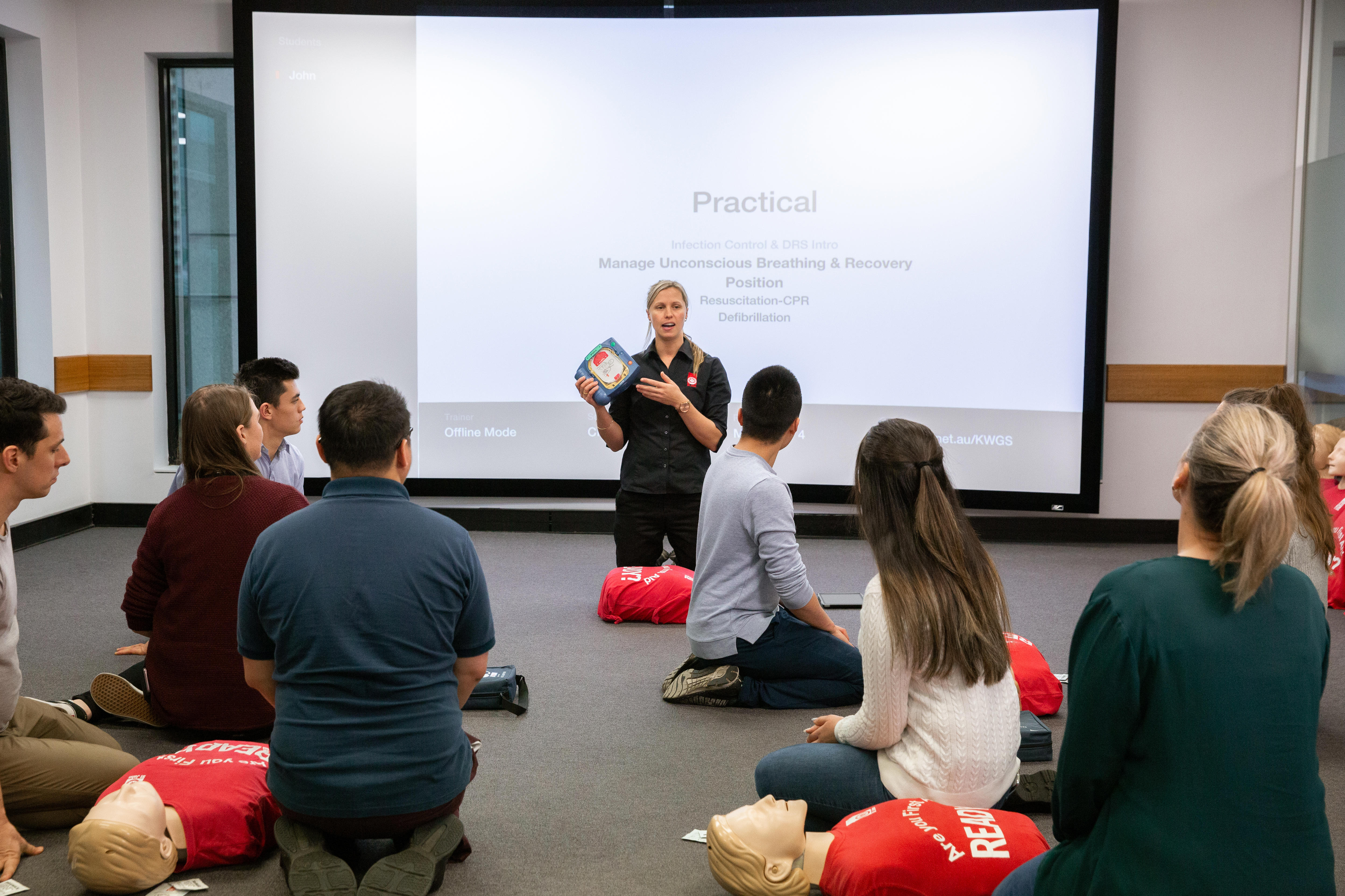 St John first aid training - trainer and students