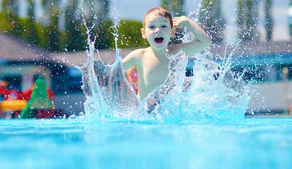 Child playing at water park