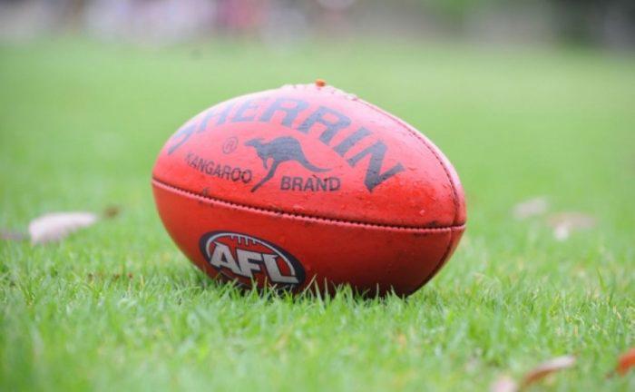 red football on the green grass