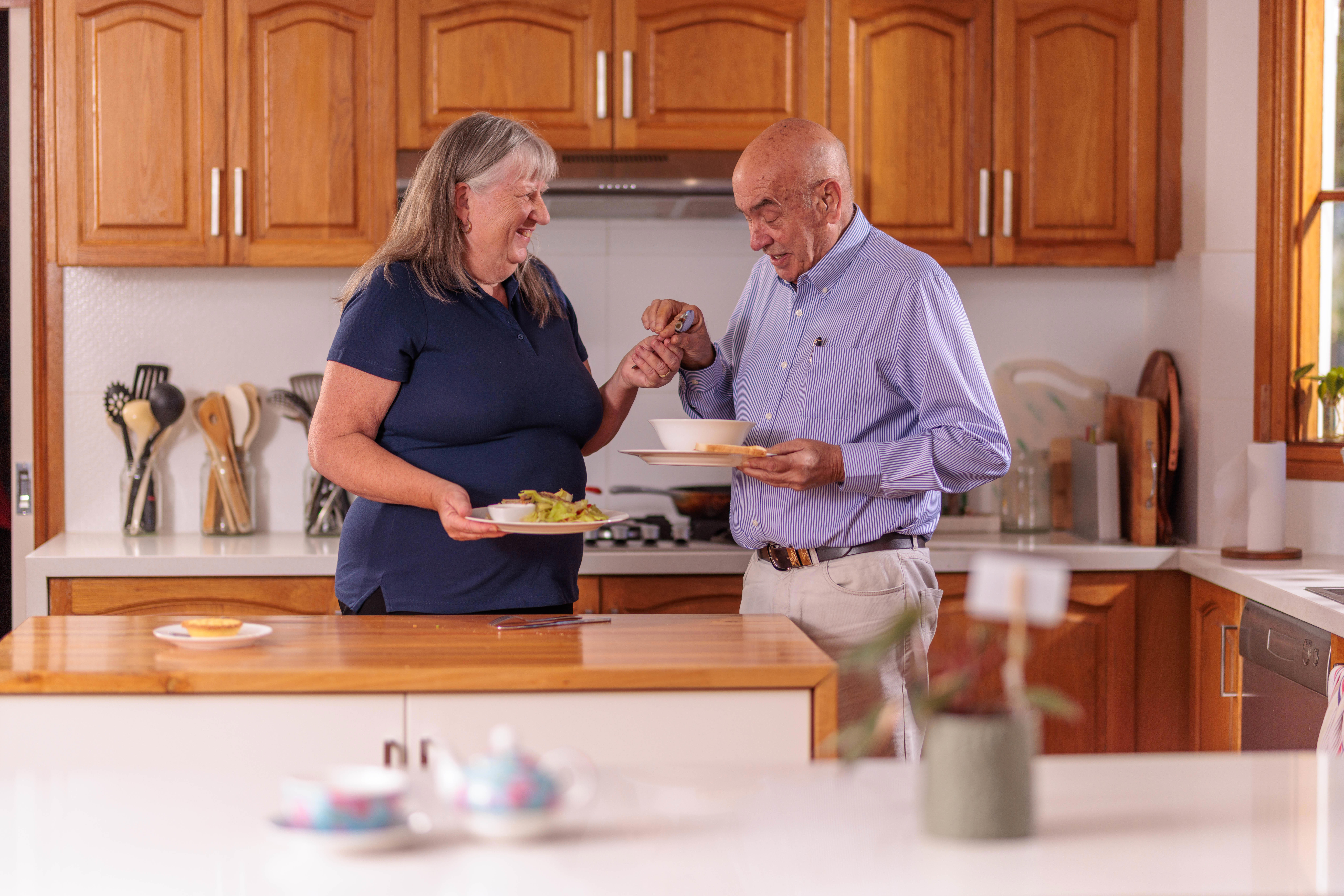 Seniors Community Care Carer with client assisting with meal preparation 