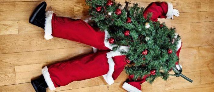 santa claus under a christmas tree on the floor