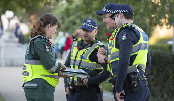 St John event volunteer working together with Victoria Police