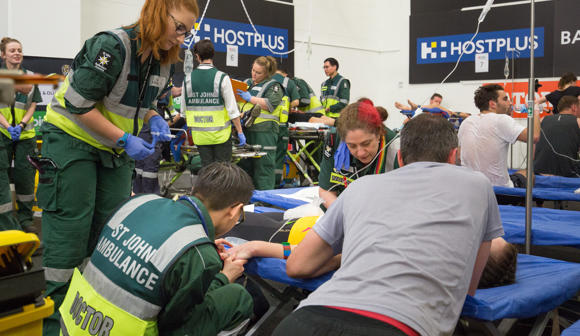 St John first aid at events volunteers tending to a patient