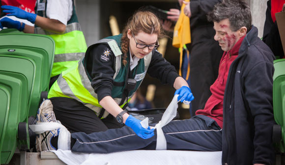 st john youth volunteers practicing first aid at event