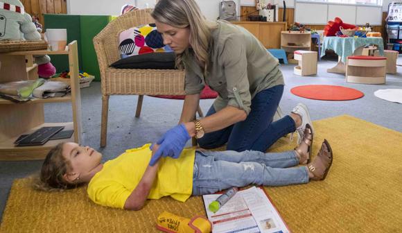 Education And Care First Aid Caring For Child At Early Learning Centre