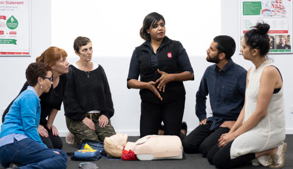 st john first aid training Trainer with students