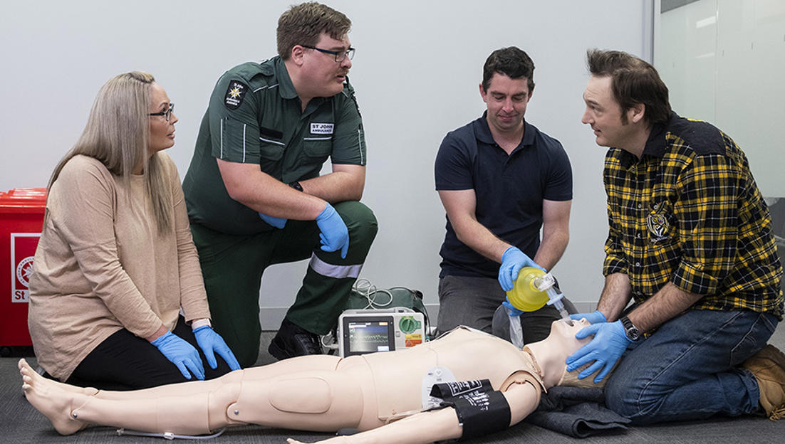 Diploma of emergency healthcare course - students performing life saving actions on mannikin
