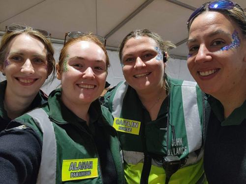 Caitlin smiling next to her fellow volunteers