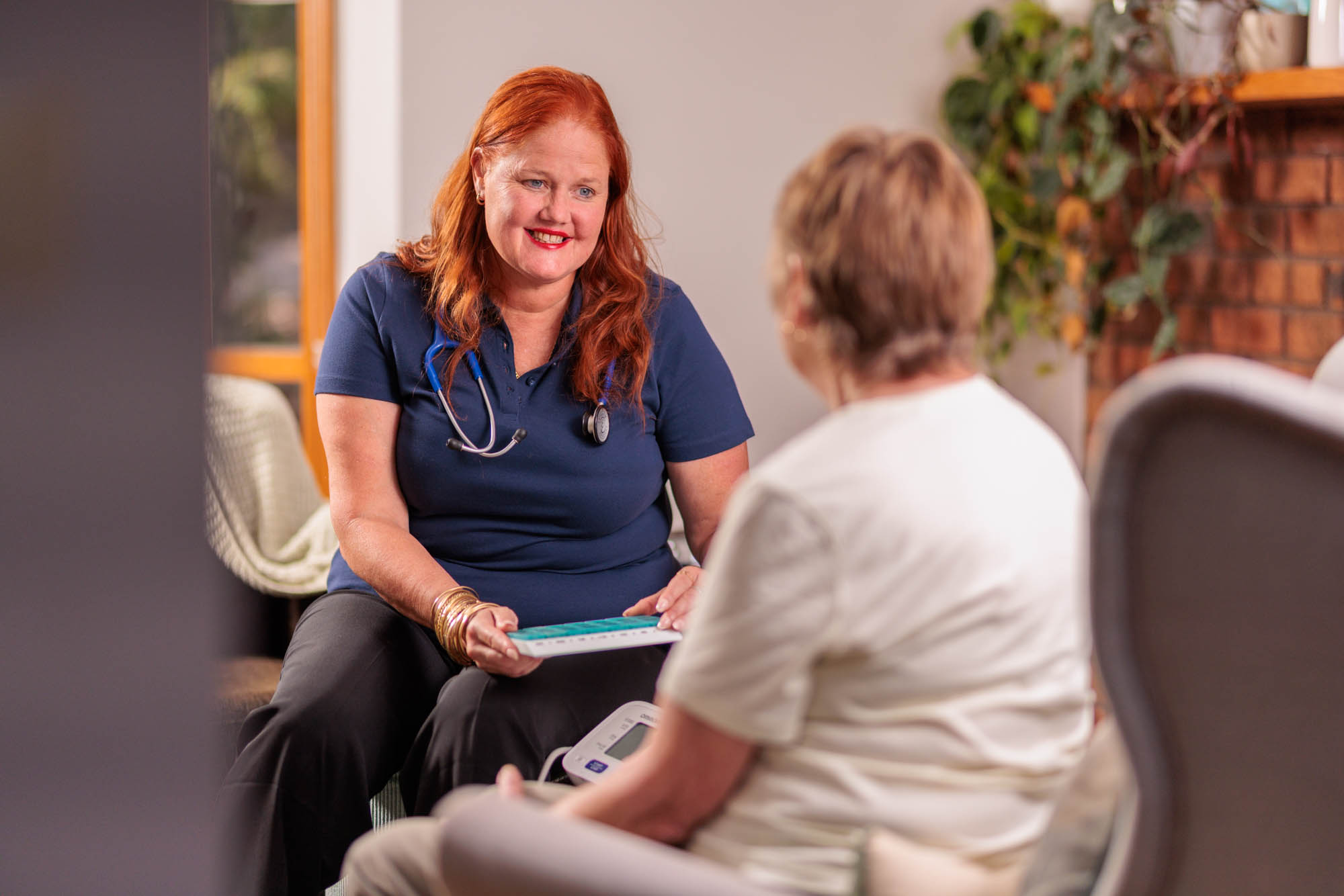 Nurse speaking with client about medication