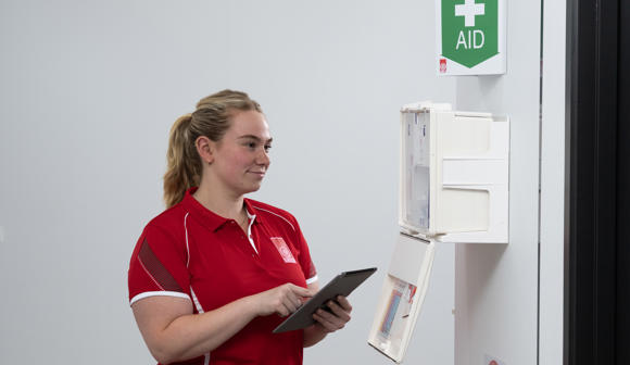 person looking through St John First Aid Kit