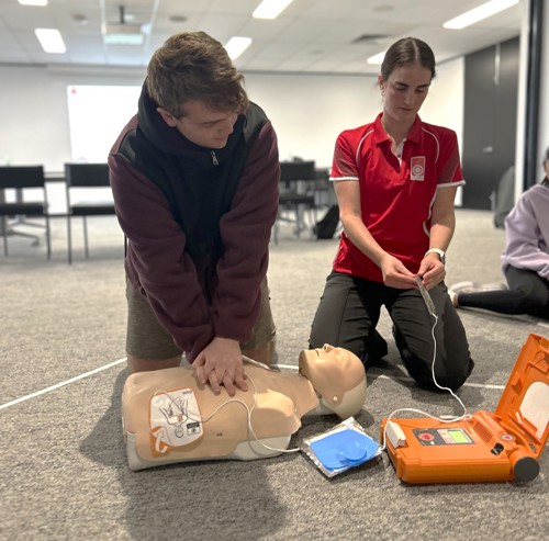 Pary Ready Student Using a Defibrillator