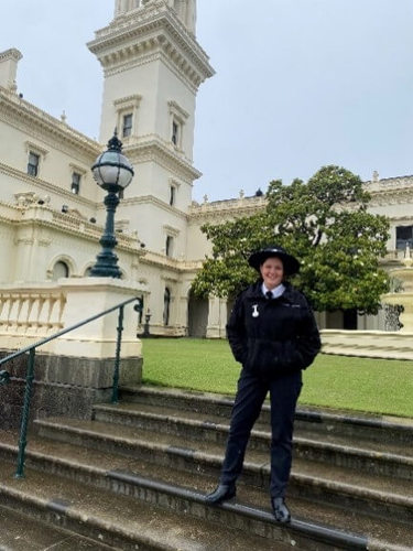 Jordan posing in front of Government House