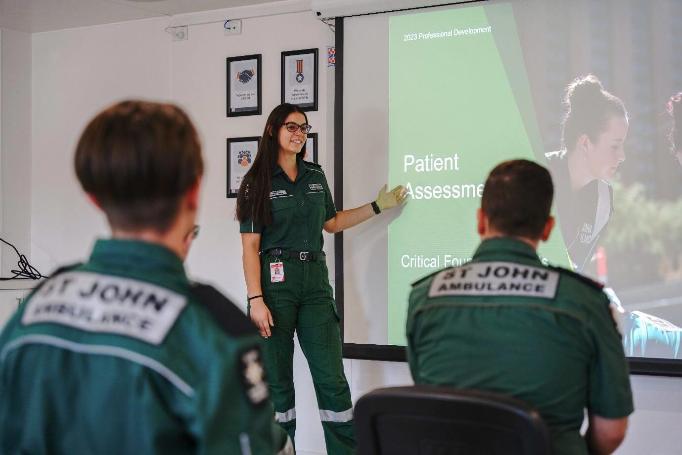Hannah presenting a PowerPoint to fellow volunteers